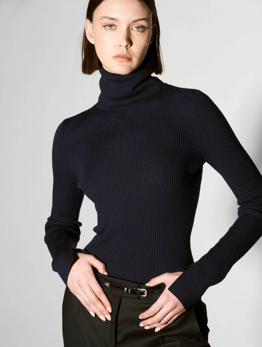 Navy merino knit rollneck sweater with piercing detail
