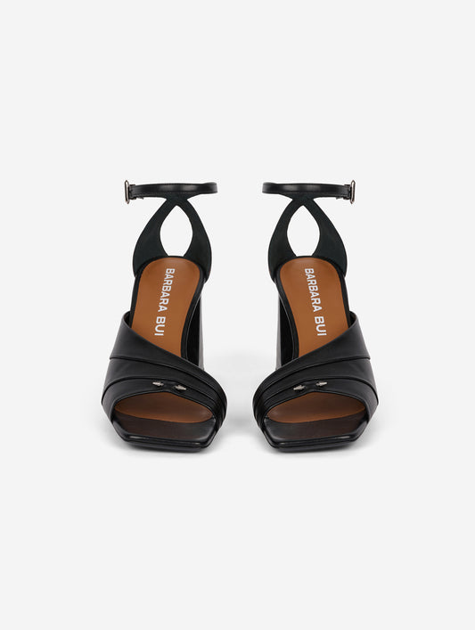Asymmetrical black leather sandals