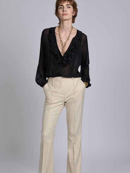 Black ruffled blouse in jacquard plumetis