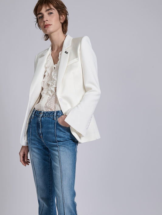 White ruffled blouse in jacquard plumetis