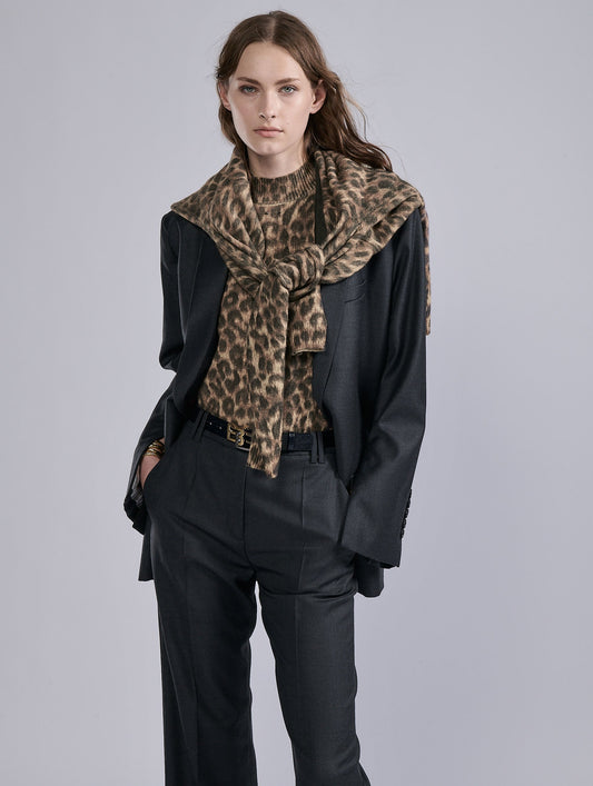 Leopard print sleeveless knit sweater.
