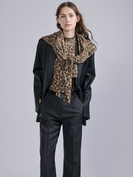 Leopard print sleeveless knit sweater.
