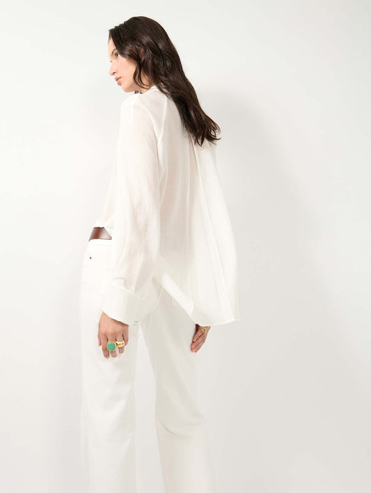 White crepon blouse with laced neckline
