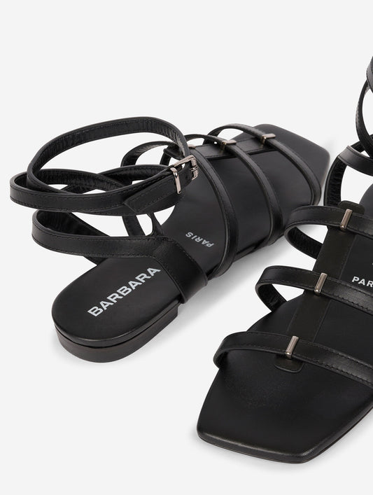 Gladiator sandals with thin black leather straps